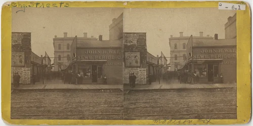 View of John R. Walsh Periodicals store on Madison Street, Chicago with the Post Office in the background, 1869