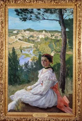 Village view. Young girl posing in a landscape of Provence