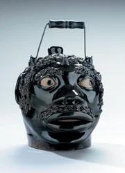 Brown-glazed and coleslaw-decorated face jug, Stine Pottery, White Cottage, Ohio