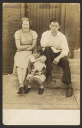 Family with Doll on Stoop