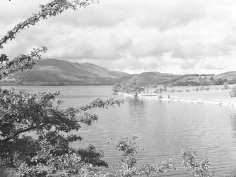 A view across Crummock Water with fells in the background