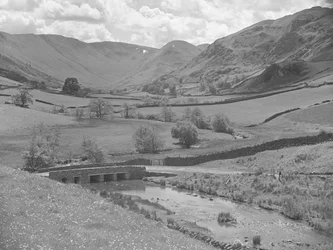 Bridge over a river surrounded by hills at Martindale