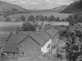 House in foreground with view down Ullswater beyond