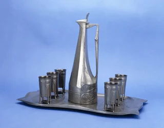 An Edelzinn Eight Piece Pewter Liquor Set