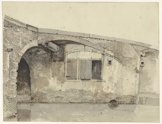 Old bridge with house or cellar windows under the quay