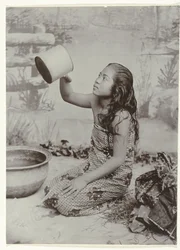 Studio portrait of a young Javanese washing woman