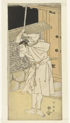 Actor Otani Oniji with raised sword, standing by gate; at night