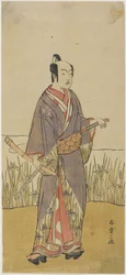An Actor in a Samurai Role Holding a Bamboo Flute
