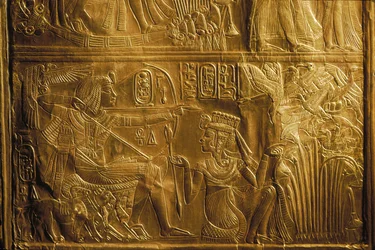 Detail of hunting birds with bow and arrow on Canopic Shrine, gold, King Tutankhamun, 2004
