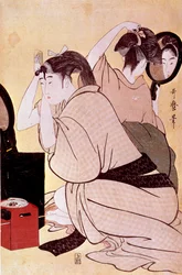 Two women arrange their hair: one looks at herself in the mirror while the other combs her hair. Japanese print by Kitagawa Utamaro (1753-1806). Dimensions: 0.38 x 0.25 m. 1794-1795. Paris, Guimet Museum, National Museum of Asian Arts