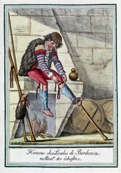 Man of the Bordeaux Moors putting on his stilts
