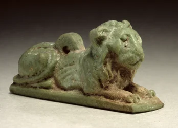 Recumbent Lion Amulet (green faience)
