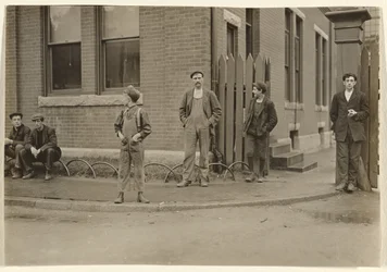 Group of Men and Boys Gathered Outside