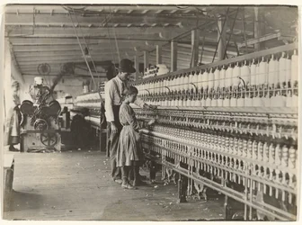 Man with Girl at Spinning Machine, South Carolina Cotton Mill