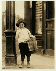 6 year old newsboy, known as Little Fattie and only 3 ft 4 ins tall, has been working for a year in St. Louis, Missouri, 1910
