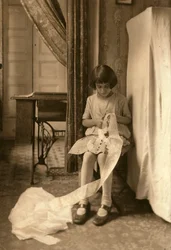 A Young Girl Cutting Lace at Her Home in New York City