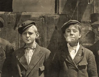 Newsboys having a cigarette break, St. Louis, Missouri. 1910