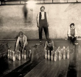 Pinboys in a Subway bowling alley, 65 South Street, Brooklyn. New York. 1910