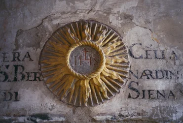 Inscriptions and relief depicting Sun, cell of dormitory of San Bernardino, Saint Francis Convent, Fiesole, Tuscany, Italy