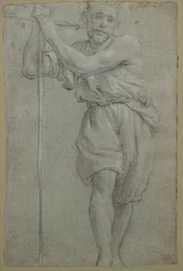 A Man Leaning on a Wooden Cross