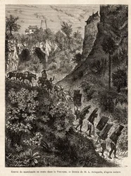 A convoy of merchants and their porters en route to Yunnan (China), engraved after the drawing of L.Delaporte, to illustrate the voyage of exploration in Indochina by Francis Garnier, lieutenant of ship, in 1866-1868, published in “Le tour du monde” 1874, 