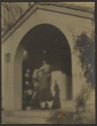Female Dancer before House