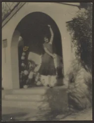 Female Dancer before House