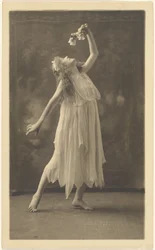 Female Dancer with Flower Before Tapestry