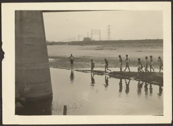 Figures in Industrial Water Scene