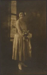 Full Length Portrait of a Woman Holding Bouquet