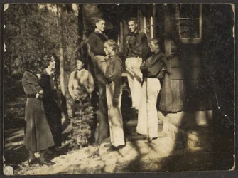 Group Standing Behind House