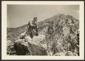 Man Atop Rocks