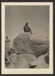 [Man Seated on Rocks]