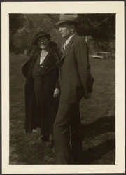 Man and Woman Standing in Grass