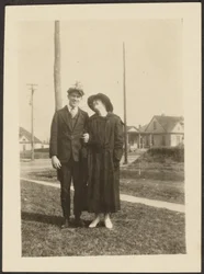 [Man and Woman on Sidewalk]