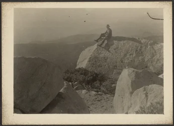 [Man on Rock]