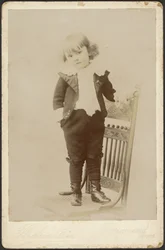 Portrait of Child Standing on Chair