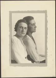 Portrait of Two Women Against White Backdrop