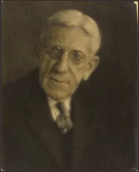 [Portrait of a Man with Glasses]