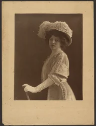 Portrait of a Woman Standing with Umbrella