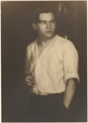 Portrait of a Young Man in Striped Shirt with Cigarette