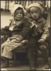 Two Children Sharing a Chair
