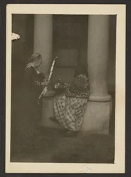 Two Figures Near Columns