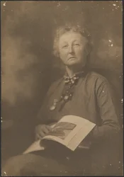 Woman Holding Magazine