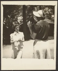 Woman Holding Purse by Face
