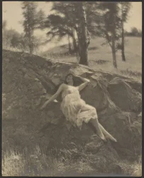 Woman Reclining on Rock Outcrop