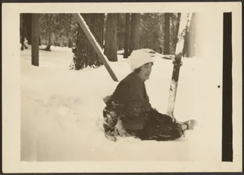 Woman Sitting in Snow