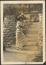 Woman with Camera on Steps