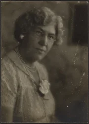 Woman with White Flower and Pearls