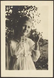 Young Woman Standing in Tree